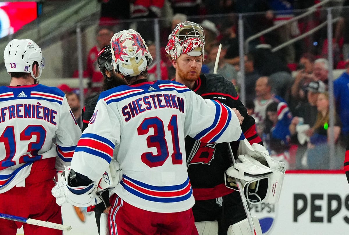 New York Rangers goaltender Igor Shesterkin (31) and Carolina Hurricanes goaltender Frederik Andersen (31) shake hands after the New York Rangers victory in game six of the second round of the 2024 Stanley Cup Playoffs at PNC Arena.