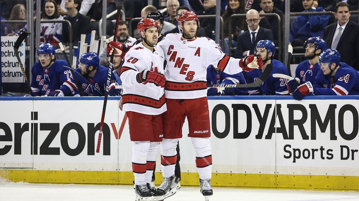 Carolina Hurricanes defenseman Jaccob Slavin (74) celebrates with center Sebastian Aho (20) after scoring a goal in the first period against the New York Rangers in game one of the second round of the 2024 Stanley Cup Playoffs at Madison Square Garden.