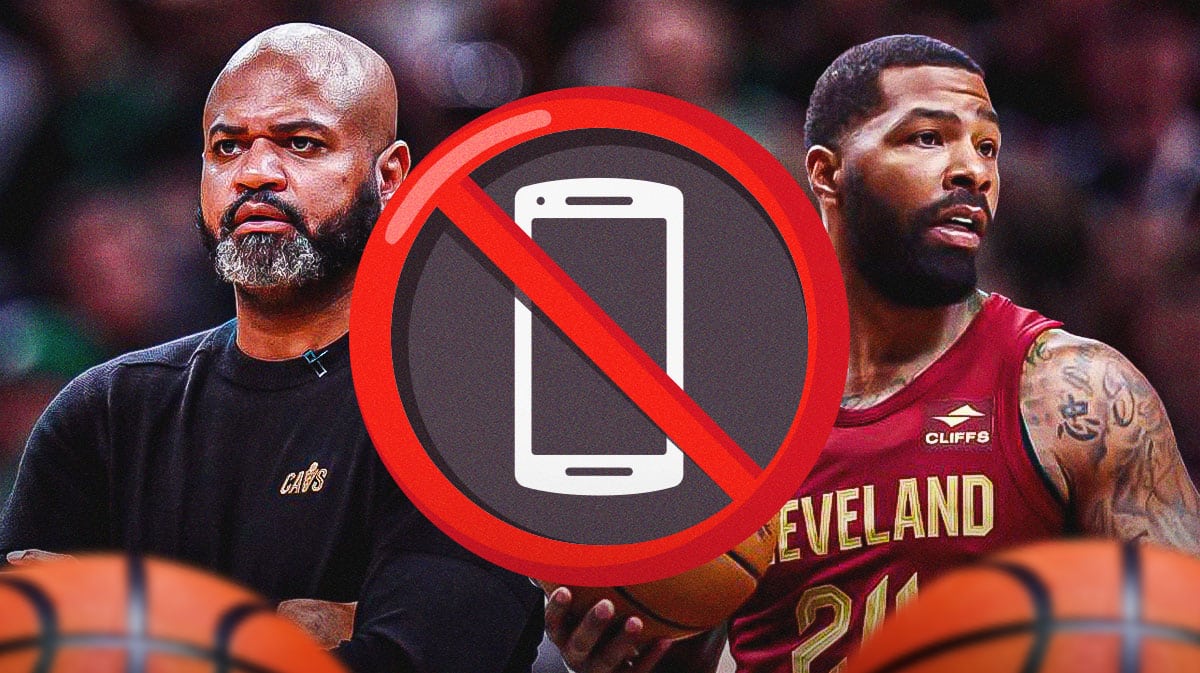 Cavs Player Marcus Morris looking at JB Bickerstaff.