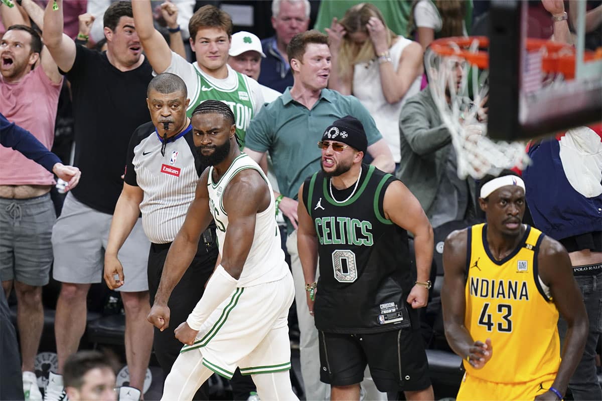 Boston Celtics guard Jaylen Brown (7) reacts after his three point basket sending the game into overtime against the Indiana Pacers in the fourth quarter during game one of the eastern conference finals for the 2024 NBA playoffs at TD Garden. 
