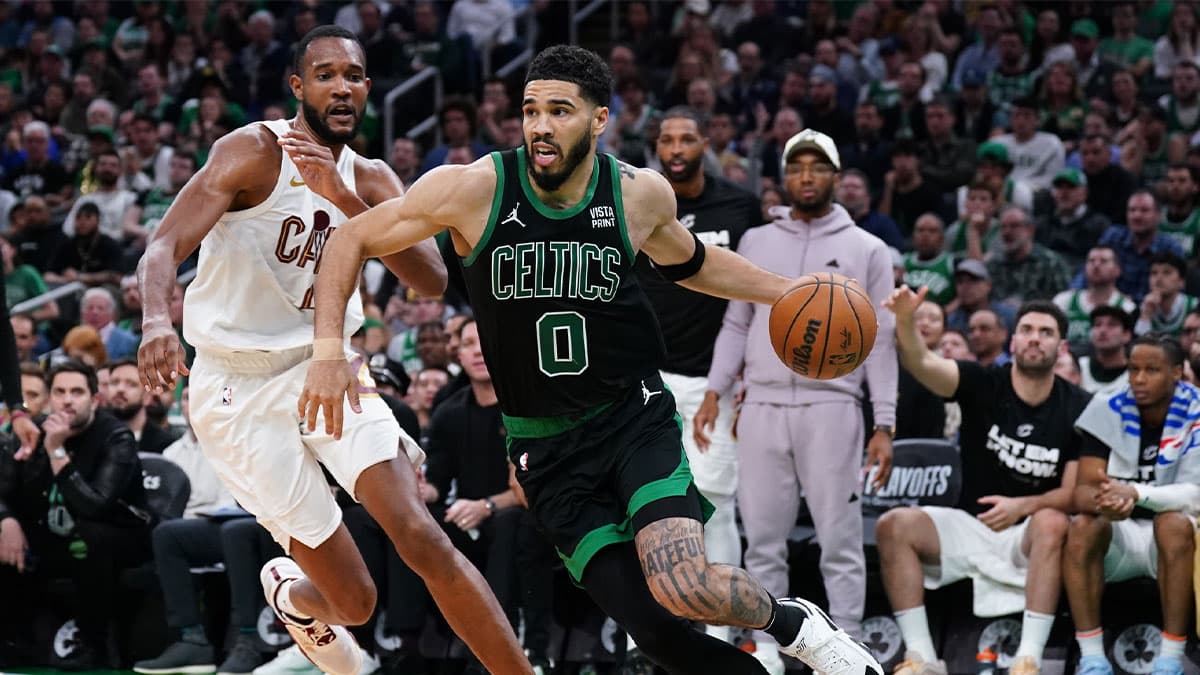 Boston Celtics forward Jayson Tatum (0) drives the ball against Cleveland Cavaliers forward Evan Mobley (4) in the third quarter during game five of the second round for the 2024 NBA playoffs at TD Garden.