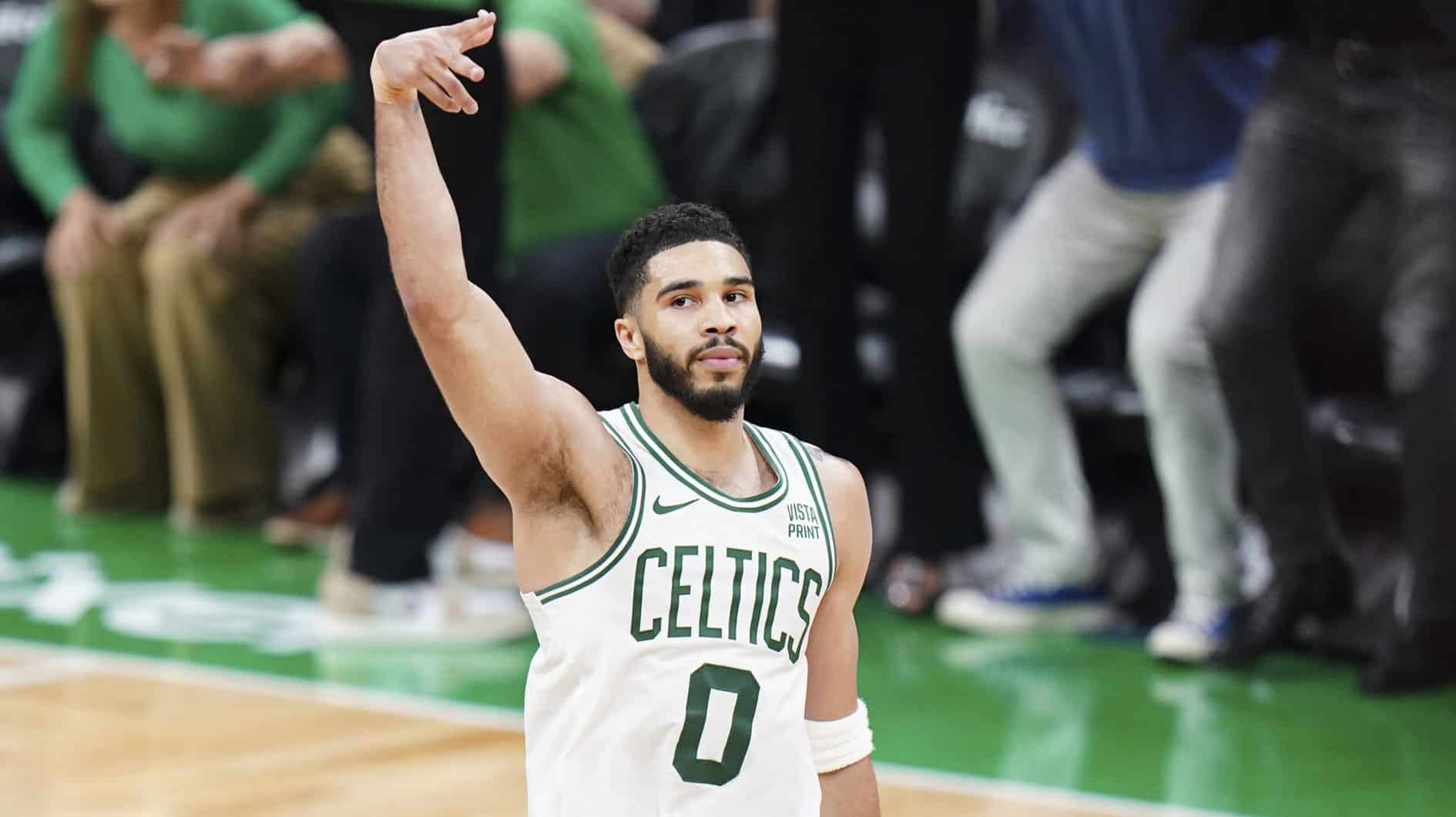 Boston Celtics forward Jayson Tatum (0) reacts after his three point basket against the Indiana Pacers in over-time during game one of the eastern conference finals for the 2024 NBA playoffs at TD Garden.