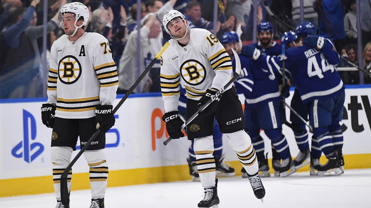 Boston Bruins defenseman Charlie McAvoy (73) and forward John Beecher (19) react as Toronto Maple Leafs players celebrate a goal by William Nylander (88) in the second period in game six of the first round of the 2024 Stanley Cup Playoffs at Scotiabank Arena.