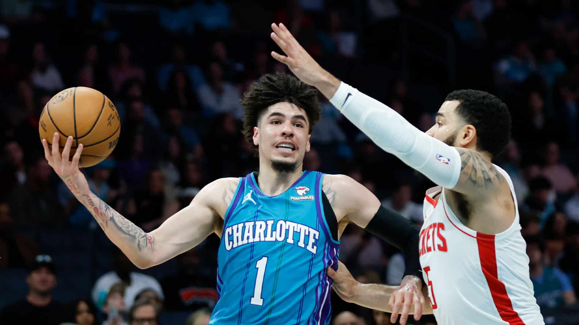 Jan 26, 2024; Charlotte, North Carolina, USA; Charlotte Hornets guard LaMelo Ball (1) moves against Houston Rockets guard Fred VanVleet (5) during the first quarter at Spectrum Center. Mandatory Credit: Nell Redmond-USA TODAY Sports