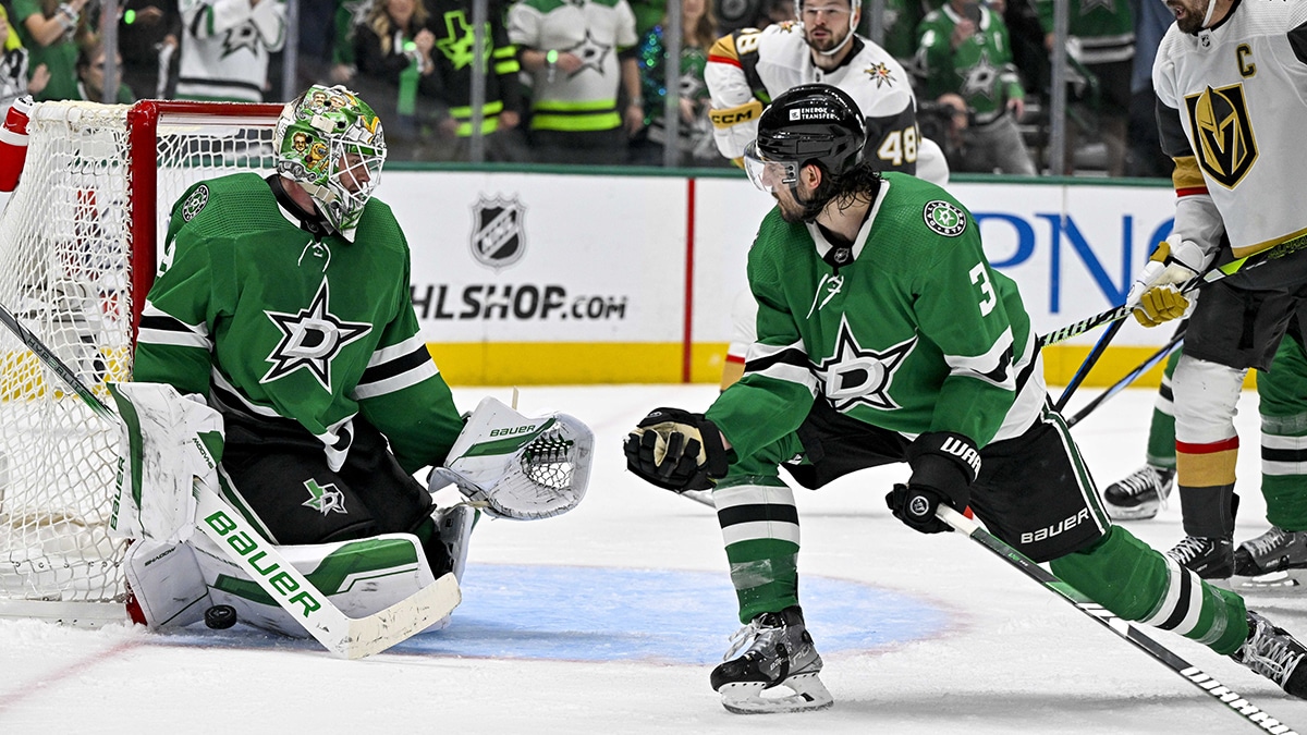 Dallas Stars goaltender Jake Oettinger (29) and defenseman Chris Tanev (3) stop a shot as Vegas Golden Knights center Tomas Hertl (48) and right wing Mark Stone (61) look for the rebound during the third period in game seven of the first round of the 2024 Stanley Cup Playoffs at American Airlines Center.