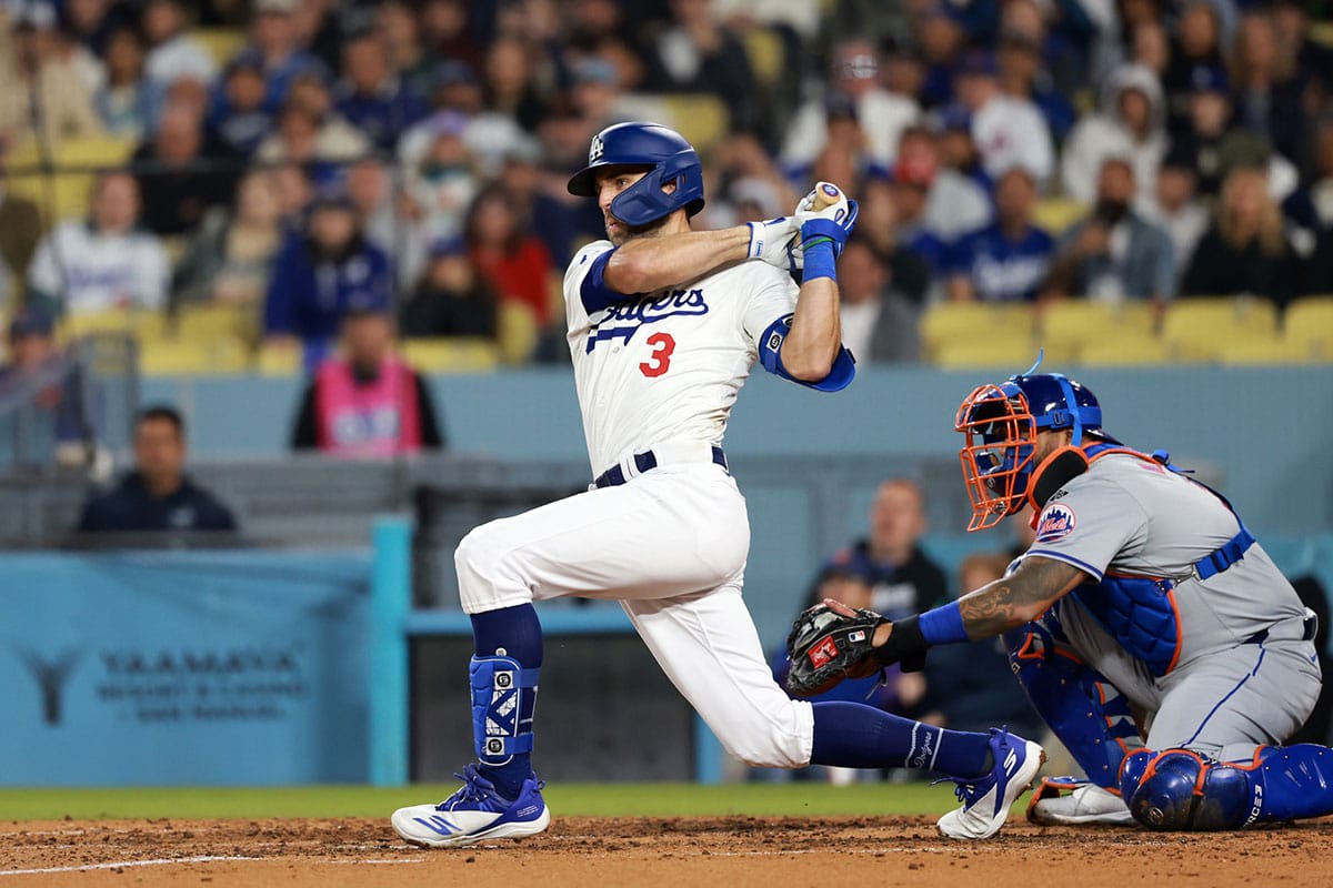Los Angeles Dodgers outfielder Chris Taylor (3) hits an RBI single during the sixth inning against the New York Mets at Dodger Stadium.