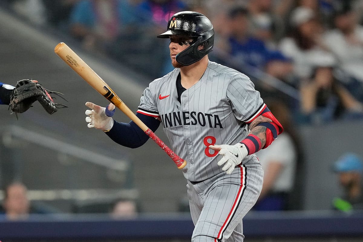 Minnesota Twins catcher Christian Vazquez (8) tosses his bat after striking out against the Toronto Blue Jays during the second inning at Rogers Centre.