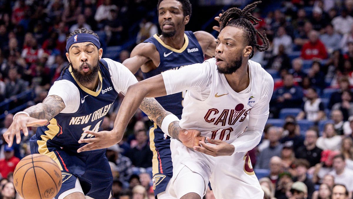 Cleveland Cavaliers guard Darius Garland (10) looks to pass the ball against New Orleans Pelicans forward Brandon Ingram (14) during the first half at Smoothie King Center. 