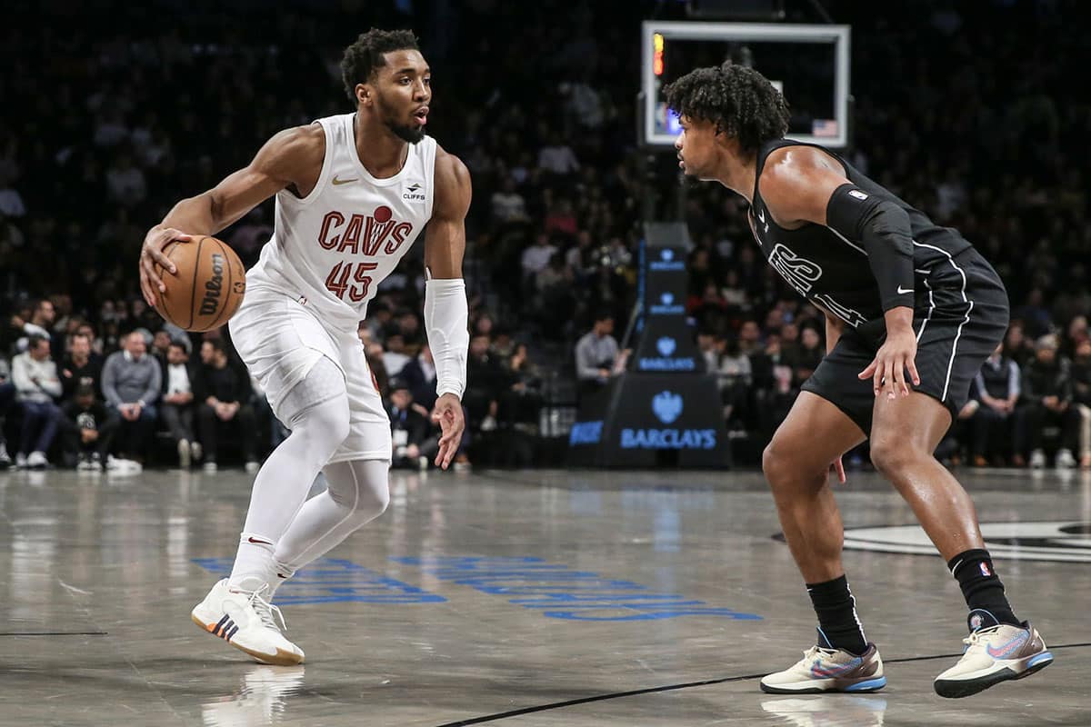 Cleveland Cavaliers guard Donovan Mitchell (45) looks to drive past Brooklyn Nets guard Dennis Smith Jr. (4) in the second quarter at Barclays Center. 