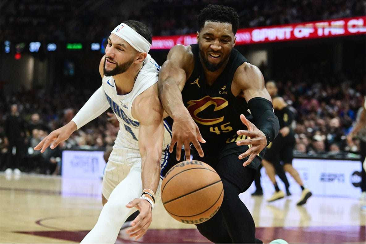 Cleveland Cavaliers guard Donovan Mitchell (45) goes for a loose ball against Orlando Magic guard Jalen Suggs (4) during the first half in game seven of the first round for the 2024 NBA playoffs at Rocket Mortgage FieldHouse. 
