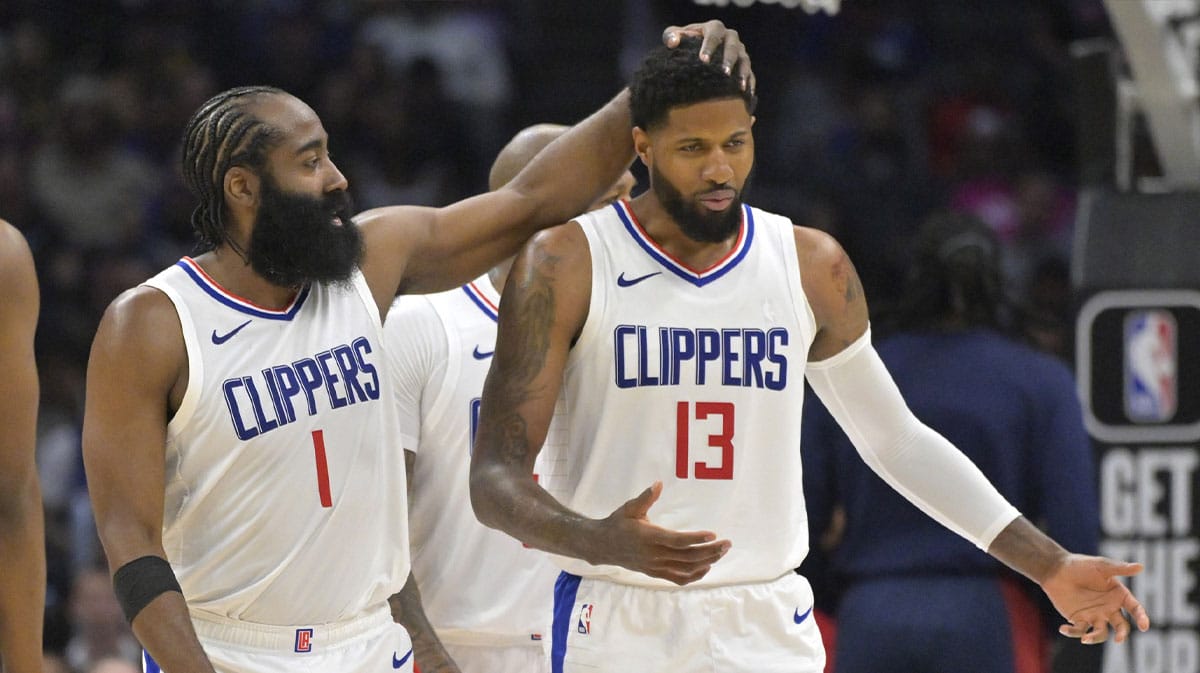Clippers forward Paul George (13) gets a pat from guard James Harden (1) in the second half