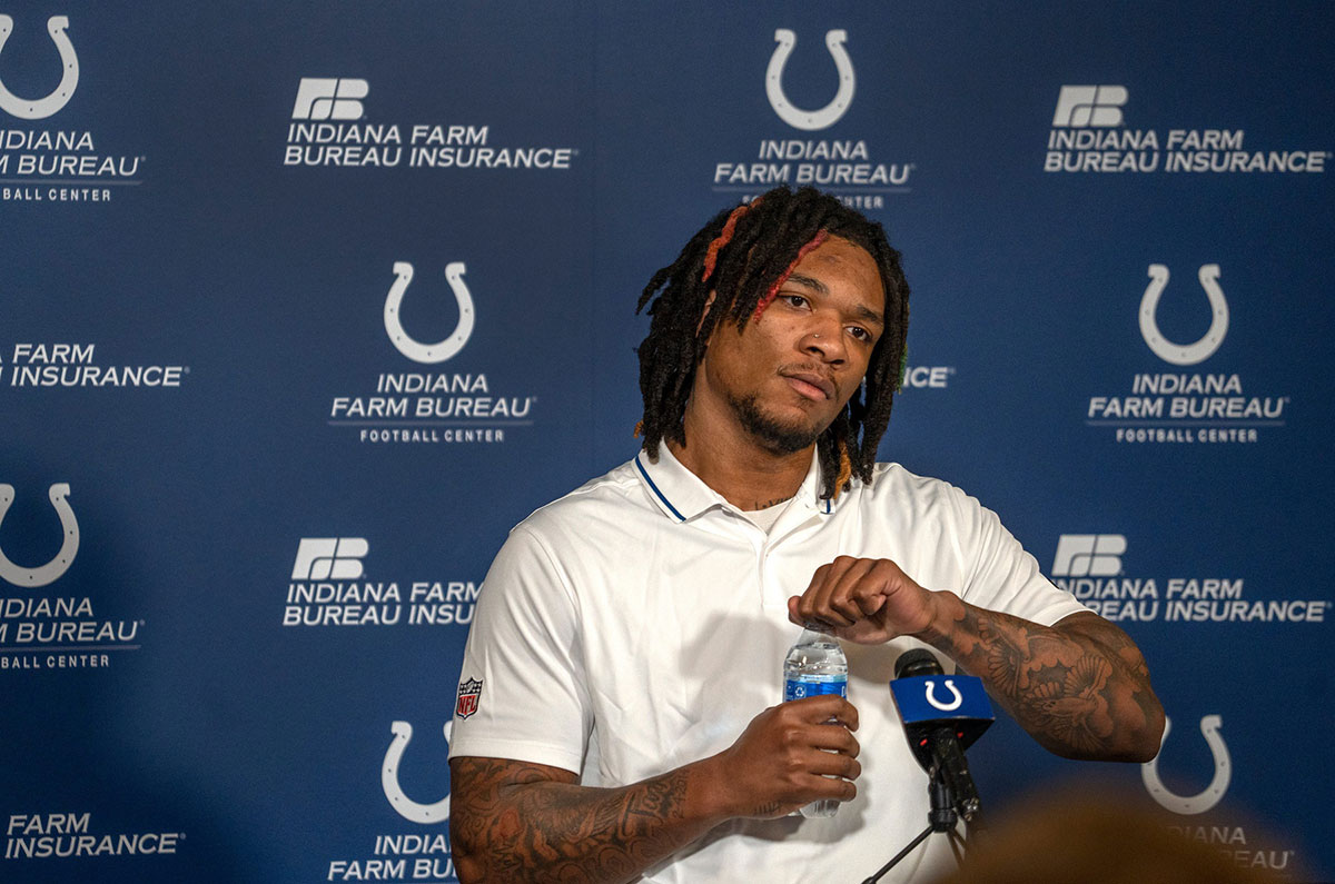 Indianapolis Colts Quarterback Anthony Richardson stretches his neck before answering questions at a press conference Thursday, Jan. 11, 2024 at the Indiana Farm Bureau Football Center, the Colts Complex.