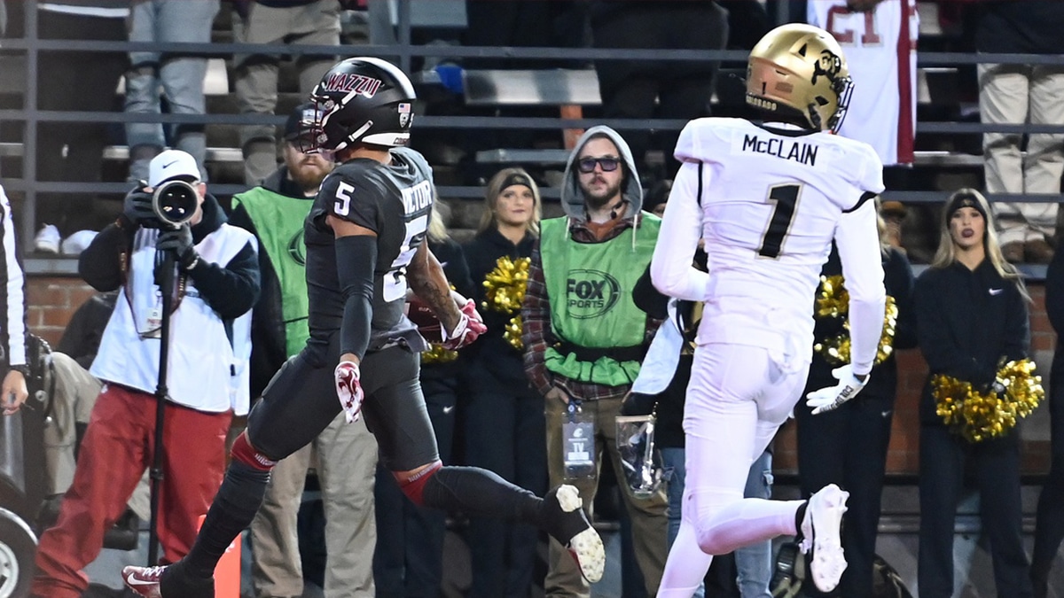 Washington State Cougars wide receiver Lincoln Victor (5) scores a touchdown against Colorado Buffaloes cornerback Cormani McClain (1) in the first half at Gesa Field at Martin Stadium.