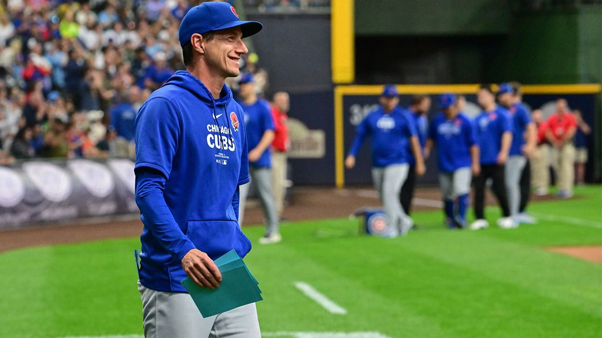 Chicago Cubs manager Craig Counsell brings out the lineup card before game against the Milwaukee Brewers at American Family Field.