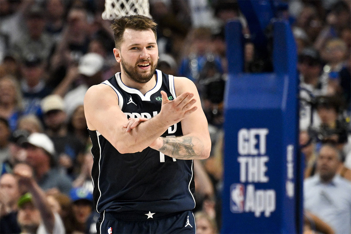 Dallas Mavericks guard Luka Doncic (77) reacts to being fouled against the Minnesota Timberwolves during the second half in game three of the western conference finals for the 2024 NBA playoffs at American Airlines Center. 