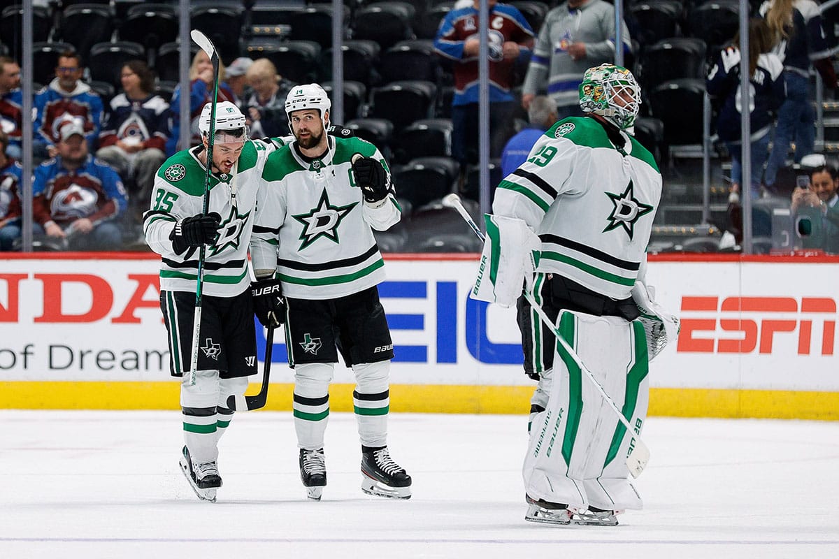 Dallas Stars center Matt Duchene (95) and left wing Jamie Benn (14) celebrate behind goaltender Jake Oettinger (29) after defeating the Colorado Avalanche in game four of the second round of the 2024 Stanley Cup Playoffs at Ball Arena.