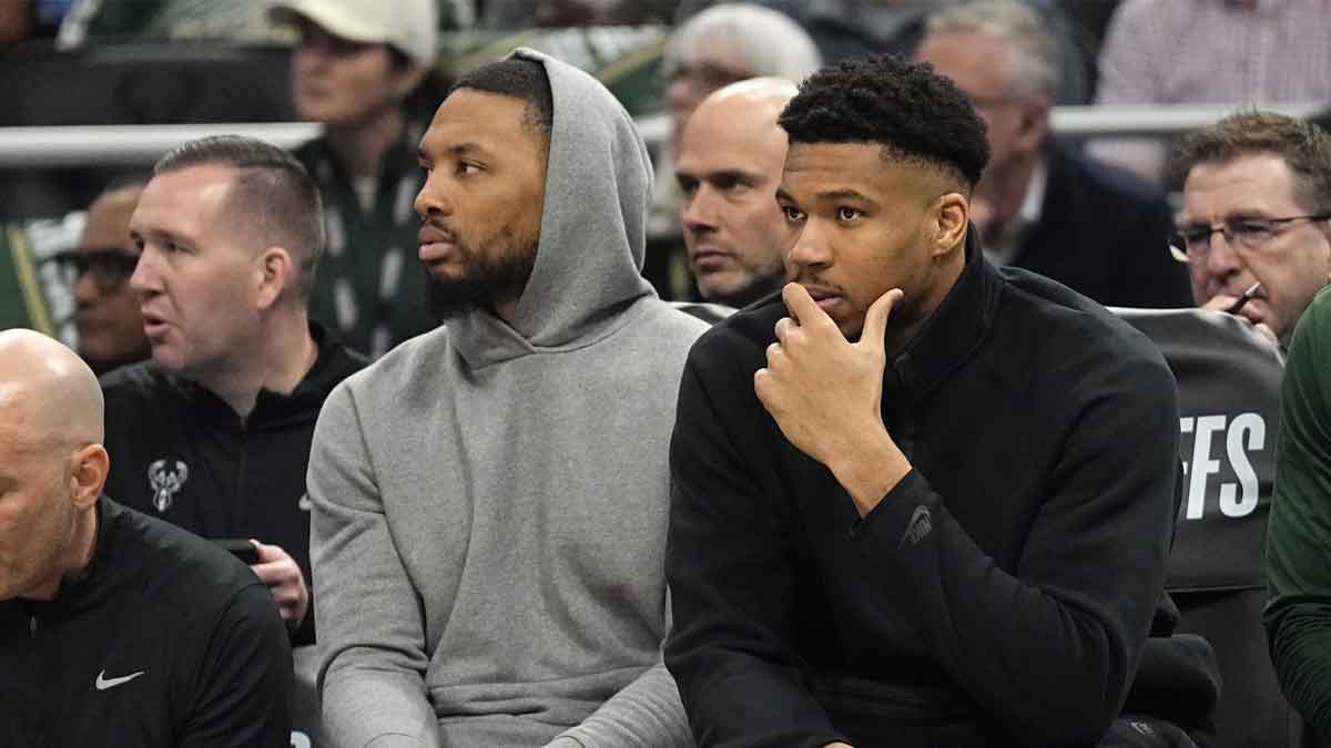 Milwaukee Bucks guard Damian Lillard and forward Giannis Antetokounmpo watch from the bench during the first quarter during game five of the first round for the 2024 NBA playoffs against the Indiana Pacers at Fiserv Forum