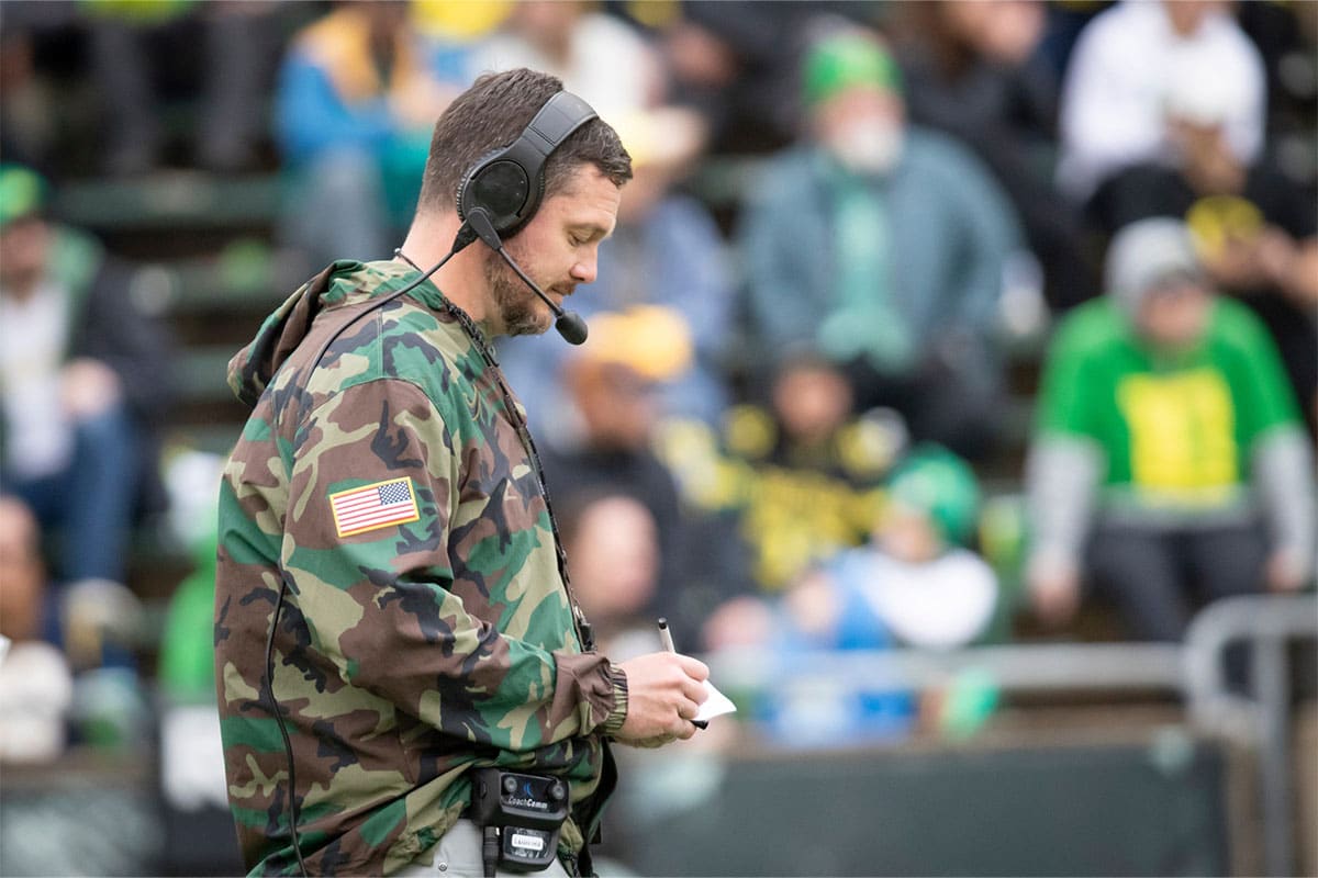 Oregon head coach Dan Lanning takes notes during the Oregon Ducks’ Spring Game