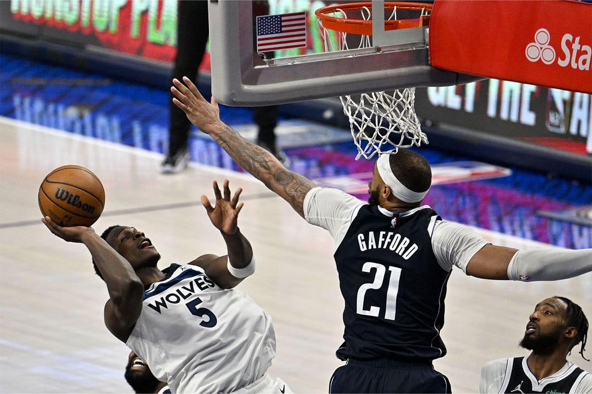 Minnesota Timberwolves guard Anthony Edwards (5) shoots over Dallas Mavericks center Daniel Gafford (21) during the second half in game four of the western conference finals for the 2024 NBA playoffs at American Airlines Center.
