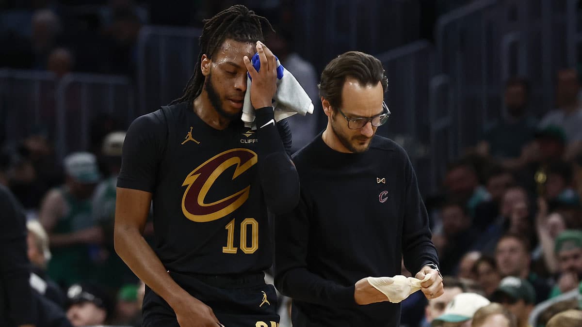 Cleveland Cavaliers guard Darius Garland (10) holds a towel to his eye