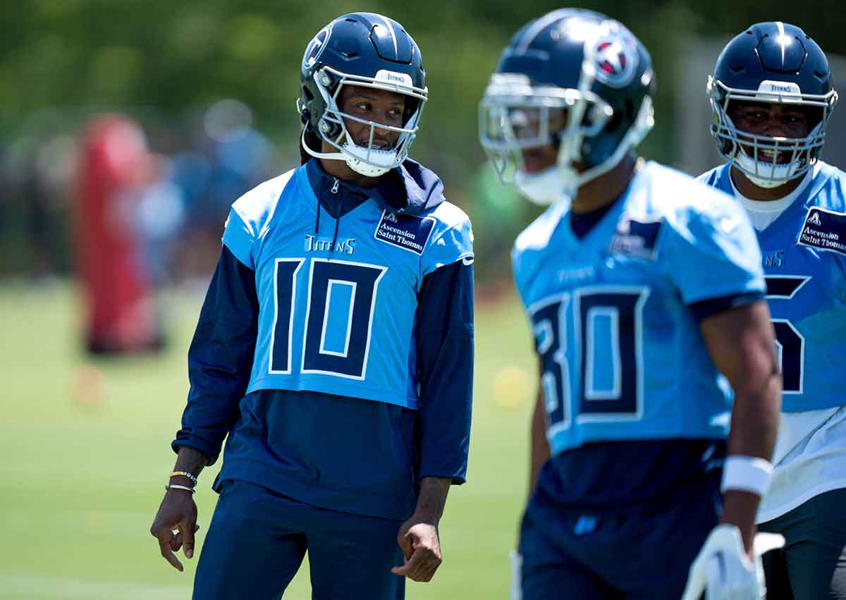 Wide receiver DeAndre Hopkins (10) and wide receiver Treylon Burks (16) communicate during Tennessee Titans practice at Ascension Saint Thomas Sports Park in Nashville, Tenn., Tuesday, May 21, 2024.