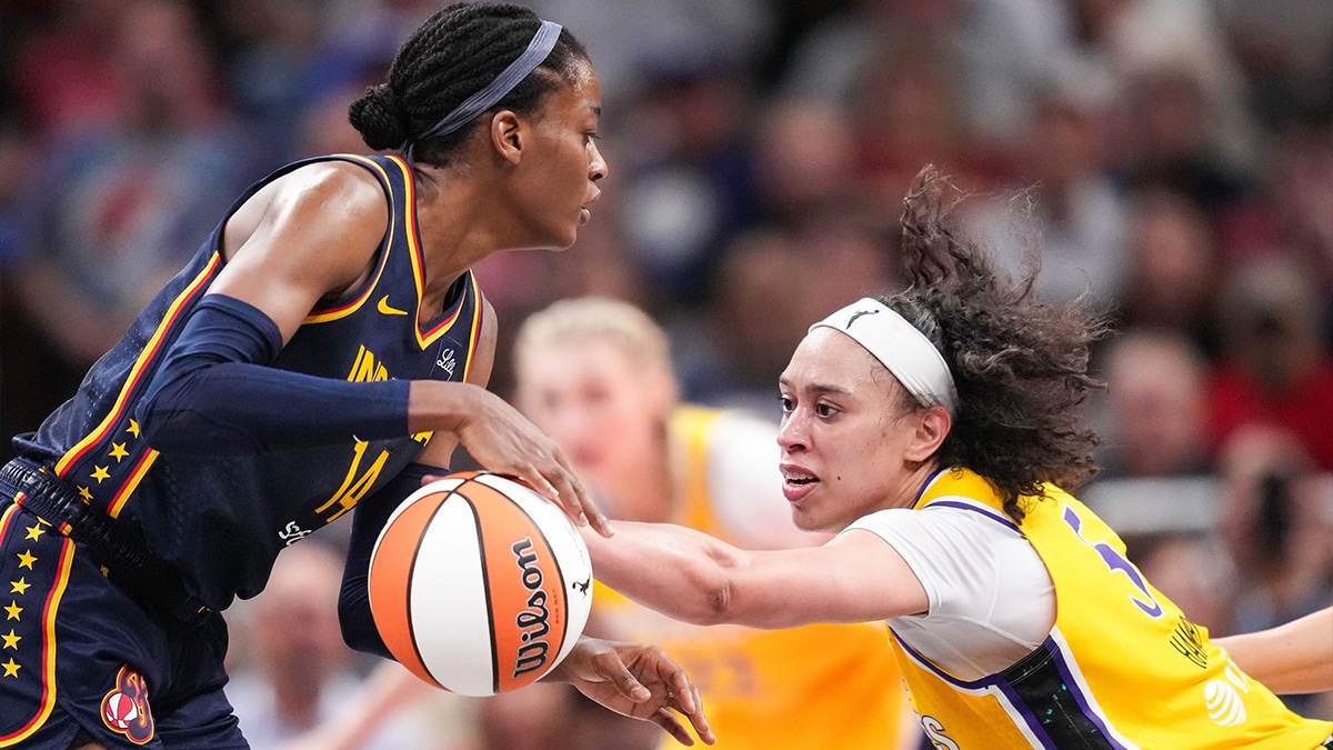Indiana Fever center Temi Fagbenle (14) rushes up the court against Los Angeles Sparks forward Dearica Hamby (5) on Tuesday, May 28, 2024, during the game at Gainbridge Fieldhouse in Indianapolis. The Los Angeles Sparks defeated the Indiana Fever, 88-82.