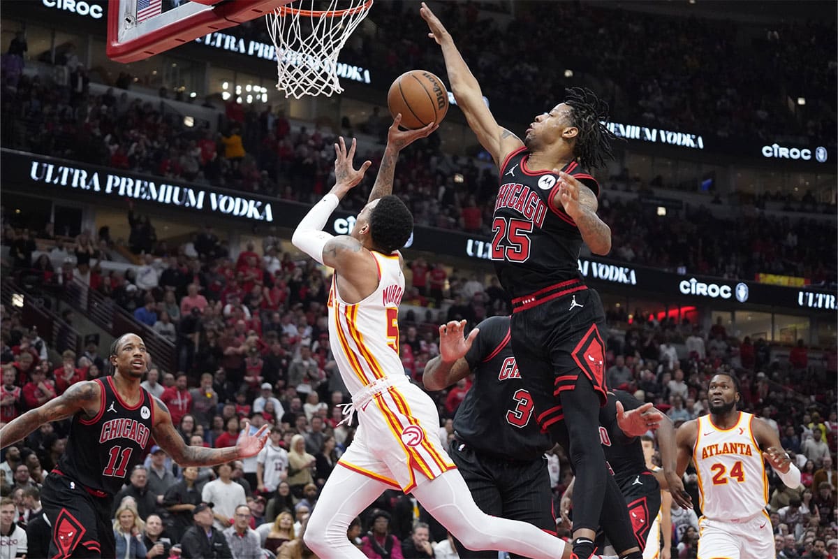 Chicago Bulls forward Dalen Terry (25) defends Atlanta Hawks guard Dejounte Murray (5) during the second half during a play-in game of the 2024 NBA playoffs at United Center.