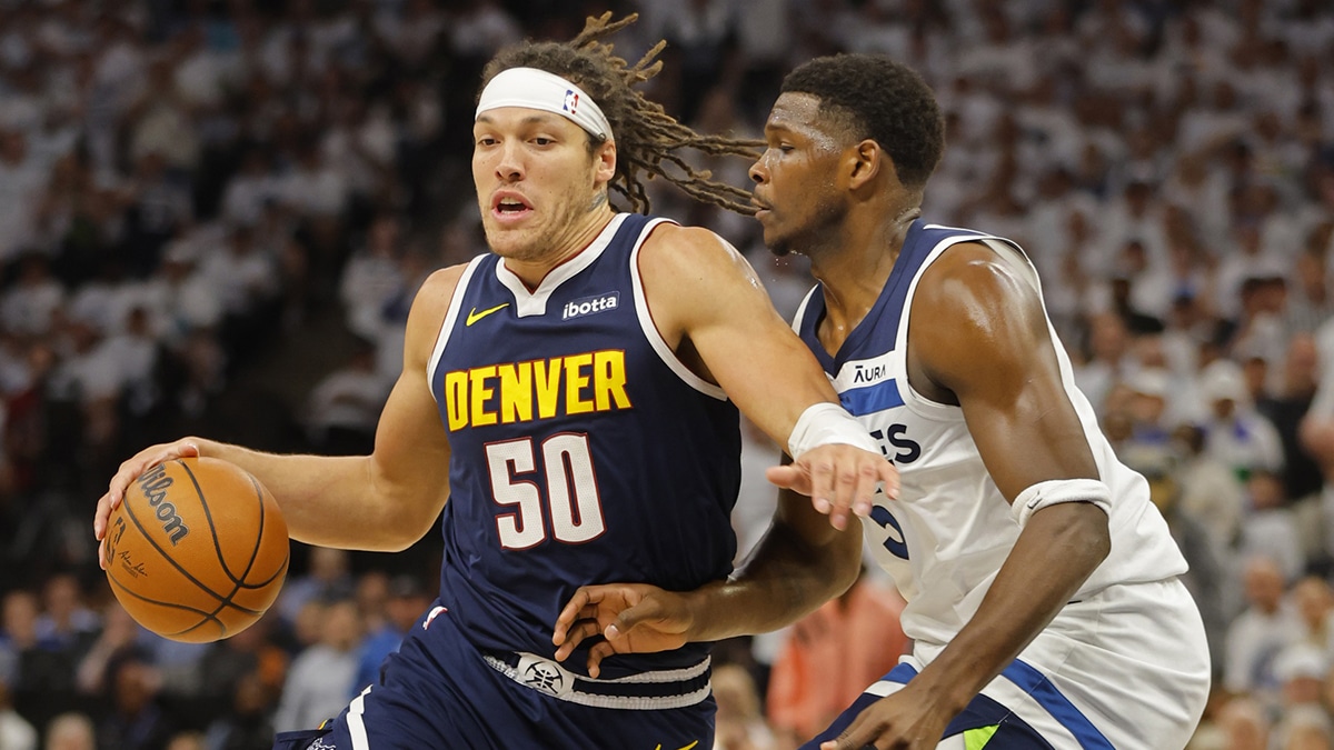 May 12, 2024; Minneapolis, Minnesota, USA; Denver Nuggets forward Aaron Gordon (50) works around Minnesota Timberwolves guard Anthony Edwards (5) in the first quarter of game four of the second round for the 2024 NBA playoffs at Target Center. Mandatory Credit: Bruce Kluckhohn-USA TODAY Sports