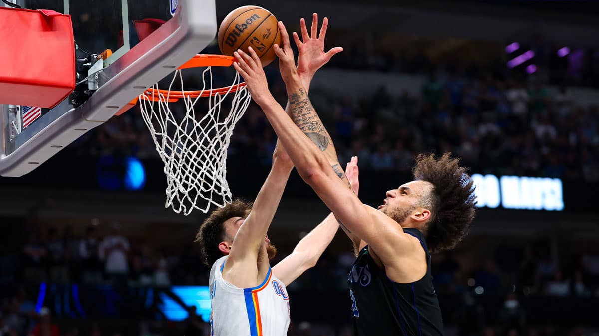 Dallas Mavericks center Dereck Lively II (2) shoots as Oklahoma City Thunder forward Chet Holmgren (7) defends during the second half in game six of the second round of the 2024 NBA playoffs at American Airlines Center. 