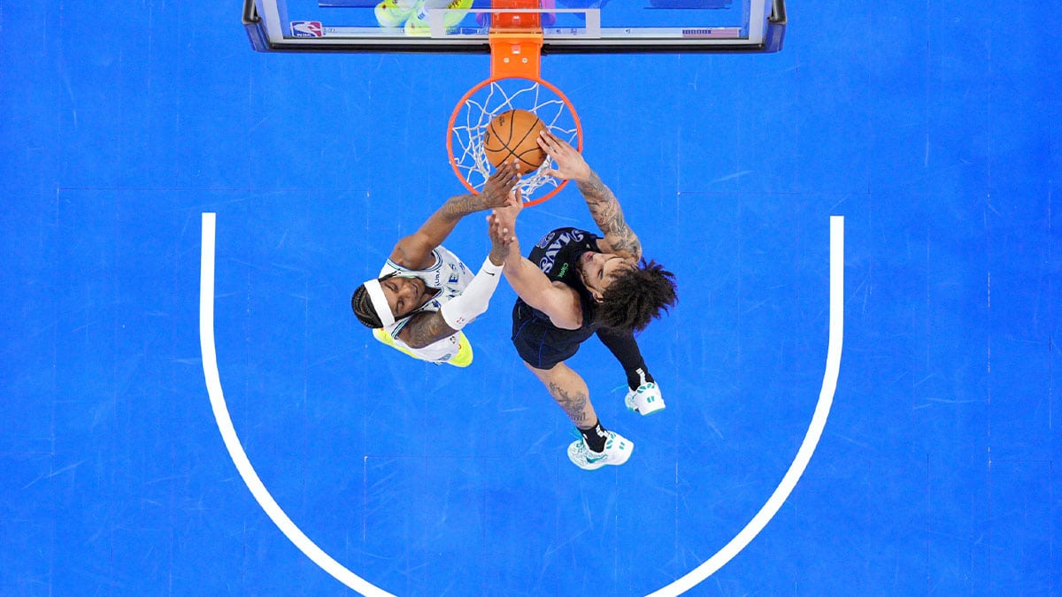 Dallas Mavericks center Dereck Lively II (2) shoots against Minnesota Timberwolves forward Jaden McDaniels (3) in the second half during game two of the western conference finals for the 2024 NBA playoffs at Target Center. 