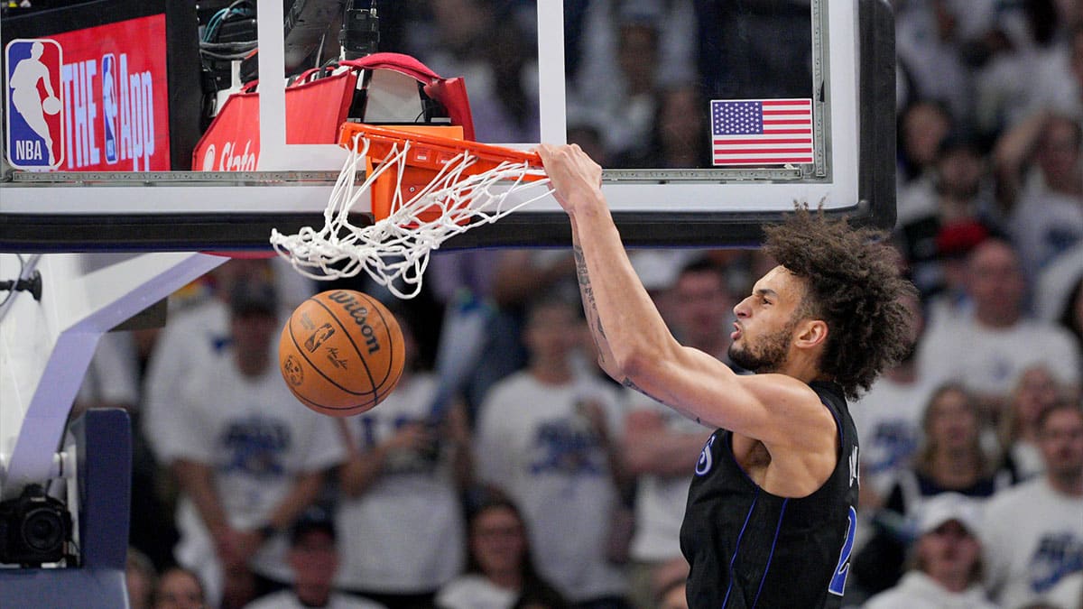 Dallas Mavericks center Dereck Lively II (2) dunks in the second quarter against the Minnesota Timberwolves during game two of the western conference finals for the 2024 NBA playoffs at Target Center. 