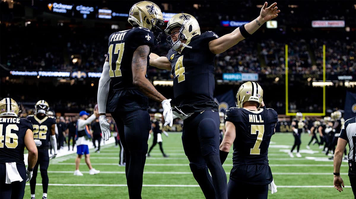 New Orleans Saints quarterback Derek Carr (4) celebrates a touchdown with wide receiver A.T. Perry (17) against the Atlanta Falcons during the second half at Caesars Superdome.