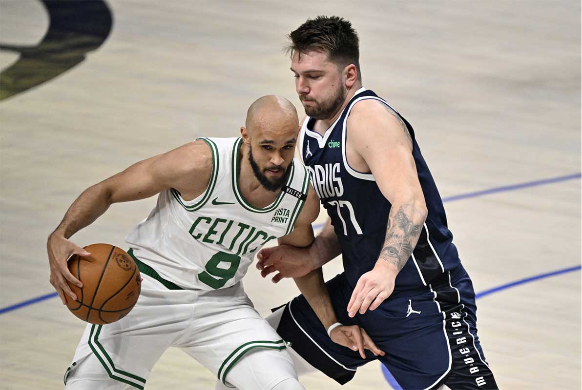 Boston Celtics guard Derrick White (9) drives against Dallas Mavericks guard Luka Doncic (77) during the first quarter in game three of the 2024 NBA Finals at American Airlines Center.