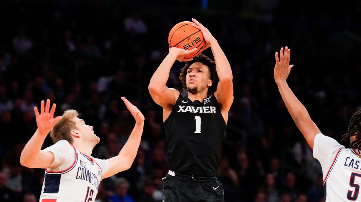 Xavier Musketeers guard Desmond Claude (1) shoots past Connecticut Huskies guard Cam Spencer (12) during the second half at Madison Square Garden. 
