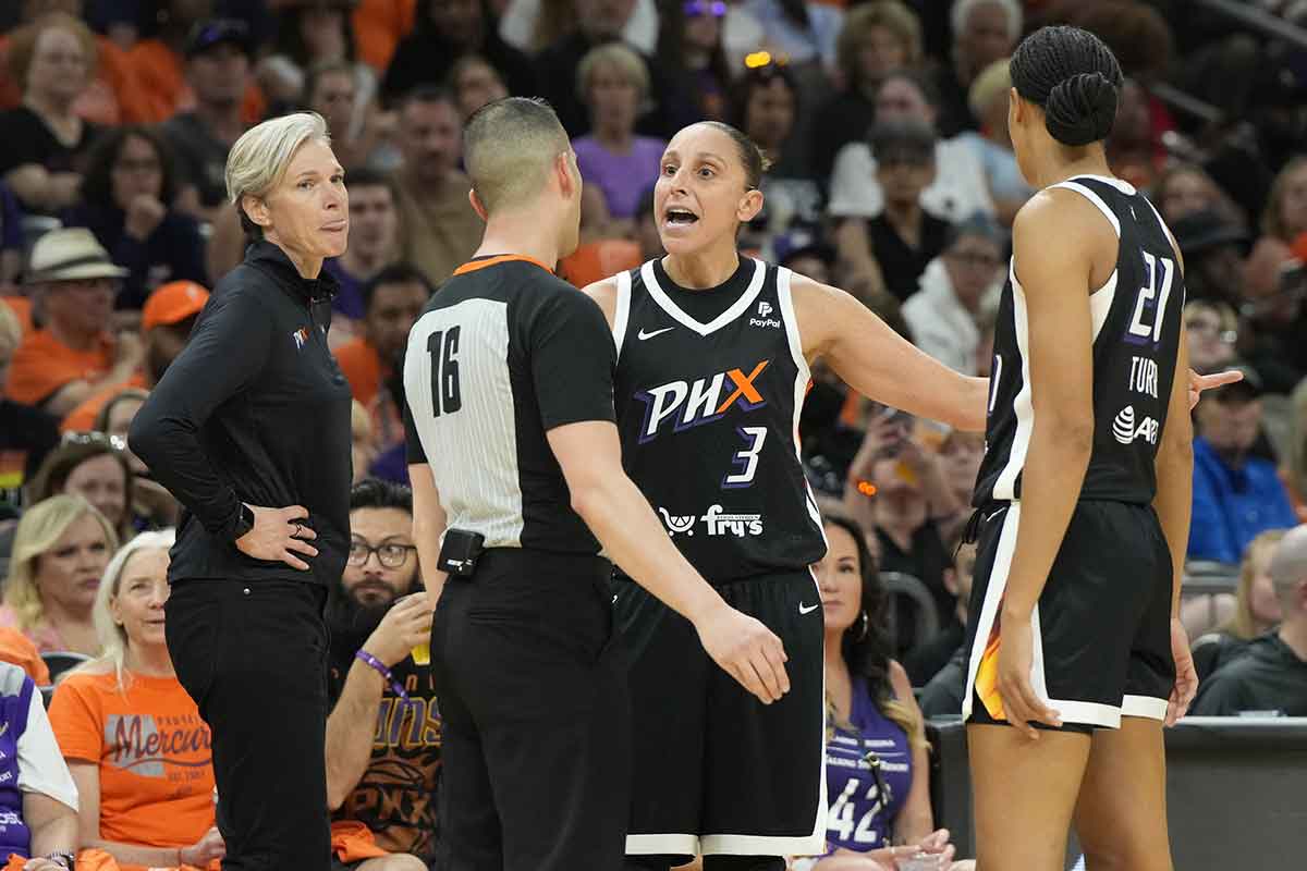 Phoenix Mercury guard Diana Taurasi (3) talks to WNBA official Isaac Barnett (16) in the second half against the Chicago Sky.
