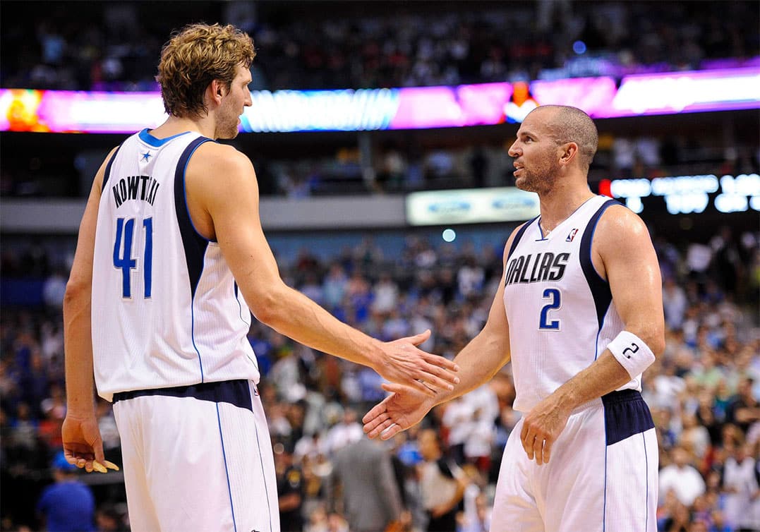 Dallas Mavericks point guard Jason Kidd (2) congratulates power forward Dirk Nowitzki (41) during the game against the Houston Rockets at the American Airlines Center.
