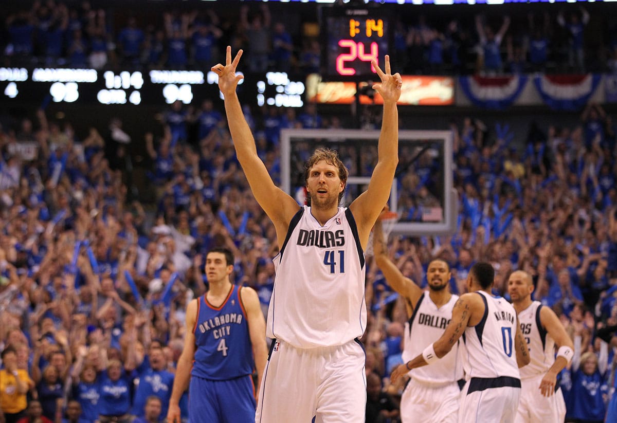 Dallas Mavericks forward Dirk Nowitzki (41) celebrates after hitting a three point basket in the fourth quarter of game five against the Oklahoma City Thunder for the Western Conference Finals of the 2011 NBA playoffs at American Airlines Center. The Mavs beat the Thunder 100-96. 