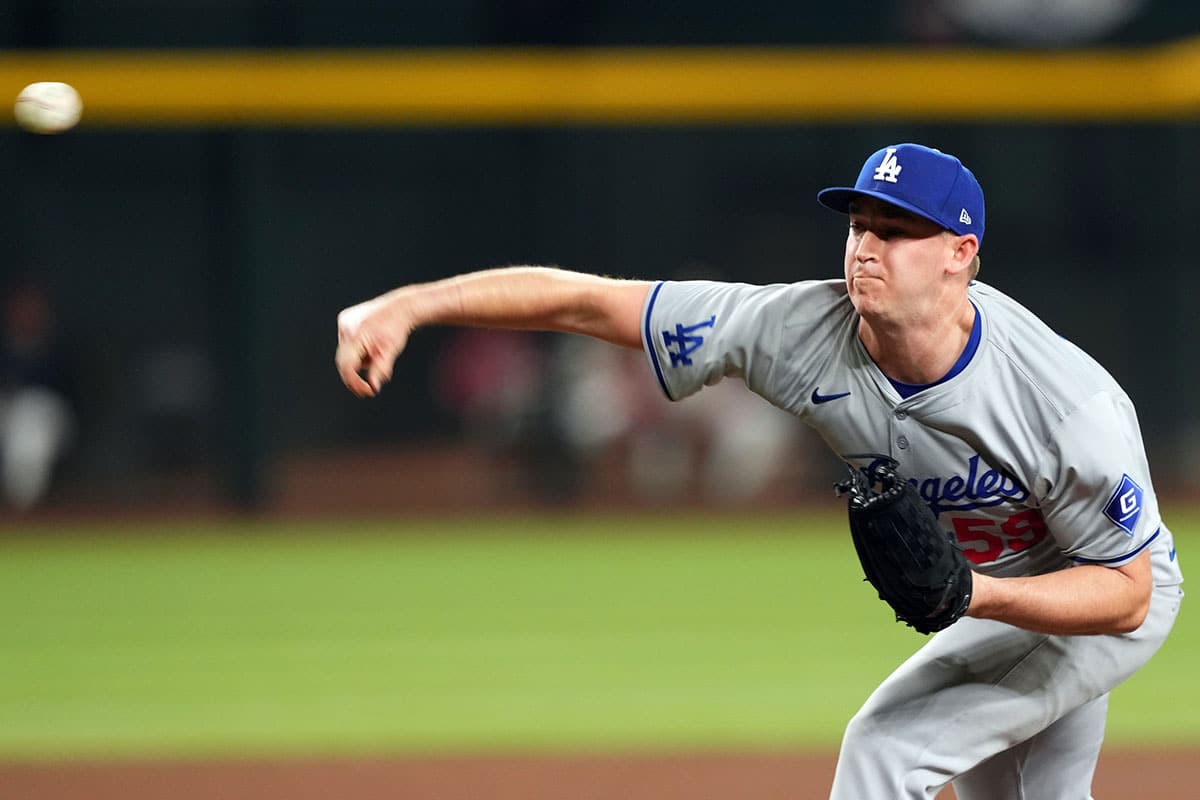 Los Angeles Dodgers pitcher Evan Phillips (59) pitches against the Arizona Diamondbacks during the ninth inning at Chase Field.