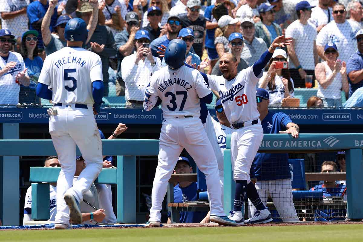 Los Angeles Dodgers outfielder Teoscar Hernandez (37) celebrates with shortstop Mookie Betts (50) after hitting a two-run home run during the sixth inning against the Miami Marlins at Dodger Stadium