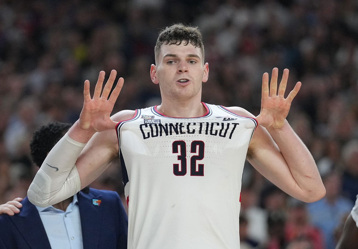 Connecticut Huskies center Donovan Clingan (32) celebrates defeating the Purdue Boilermakers in the national championship game of the Final Four of the 2024 NCAA Tournament at State Farm Stadium.