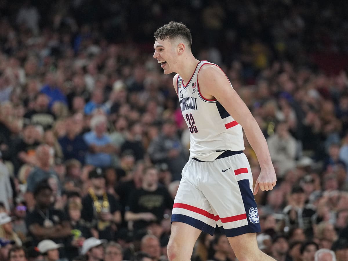 Connecticut Huskies center Donovan Clingan (32) reacts in the second half against the Purdue Boilermakers in the national championship game of the Final Four of the 2024 NCAA Tournament at State Farm Stadium. 
