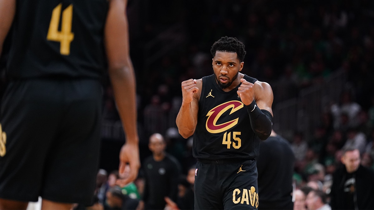 Cleveland Cavaliers guard Donovan Mitchell (45) reacts after a basket buy forward Evan Mobley (4) against the Boston Celtics in the first quarter during game two of the second round for the 2024 NBA playoffs at TD Garden. 