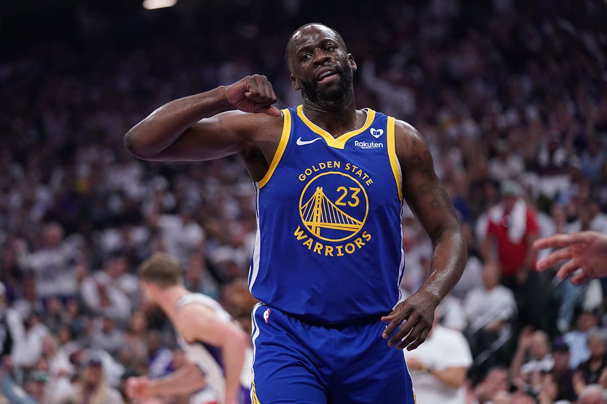 Golden State Warriors forward Draymond Green (23) reacts after a play against the Sacramento Kings in the first quarter during a play-in game of the 2024 NBA playoffs at the Golden 1 Center. 