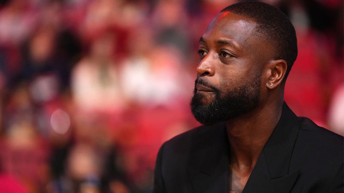 Former Miami Heat player Dwayne Wade reacts after learning a statue will be erected outside of Kaseya Center in 2025, during a special ceremony during halftime of the game between the Miami Heat and the Charlotte Hornets.