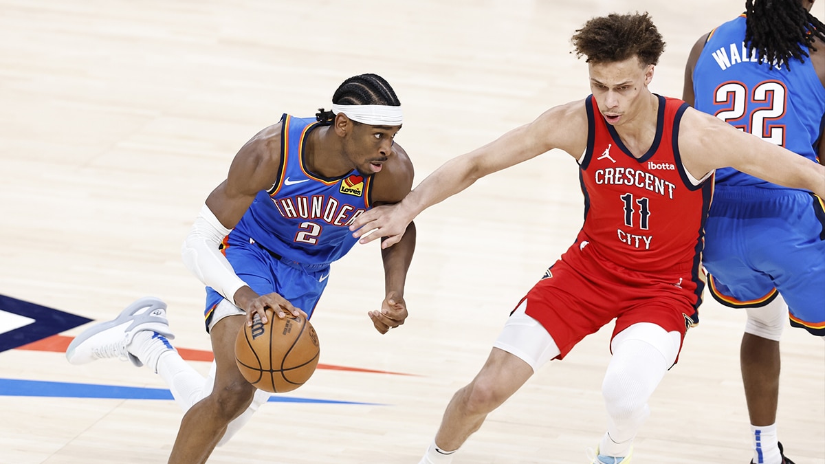 Oklahoma City Thunder guard Shai Gilgeous-Alexander (2) moves around New Orleans Pelicans guard Dyson Daniels (11) during the second half of game two of the first round for the 2024 NBA playoffs at Paycom Center.