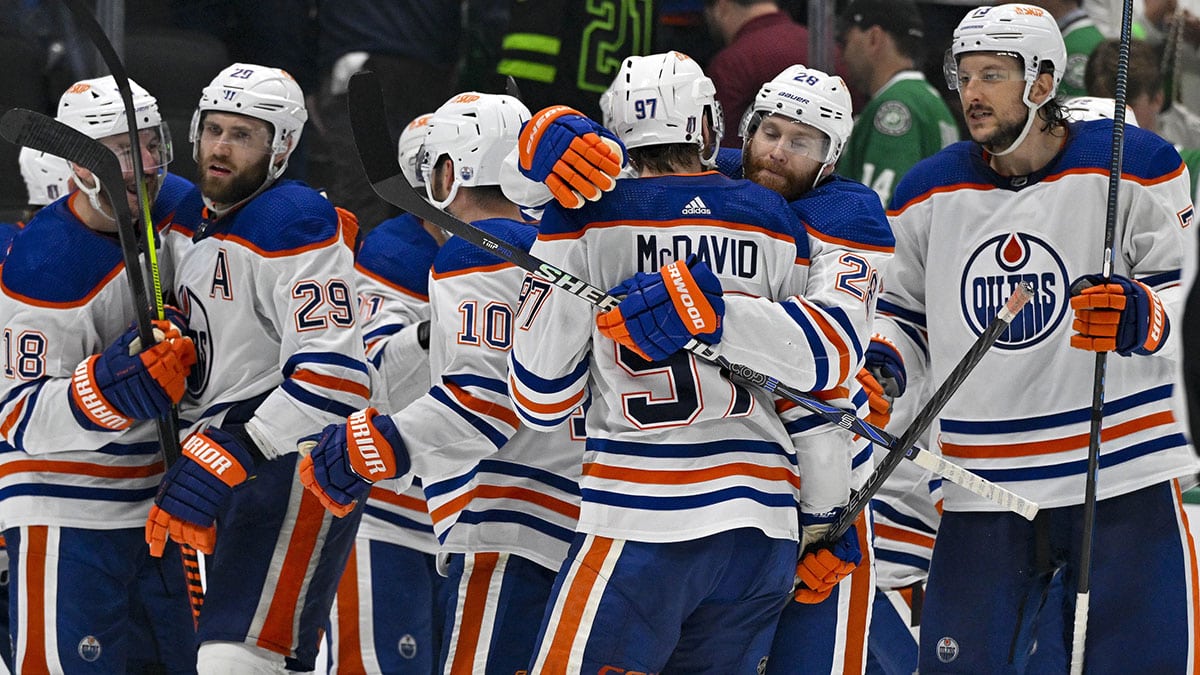 The Edmonton Oilers celebrates center Connor McDavid (97) scoring the game winning goal against the Dallas Stars during the second overtime period in game one of the Western Conference Final of the 2024 Stanley Cup Playoffs at American Airlines Center.