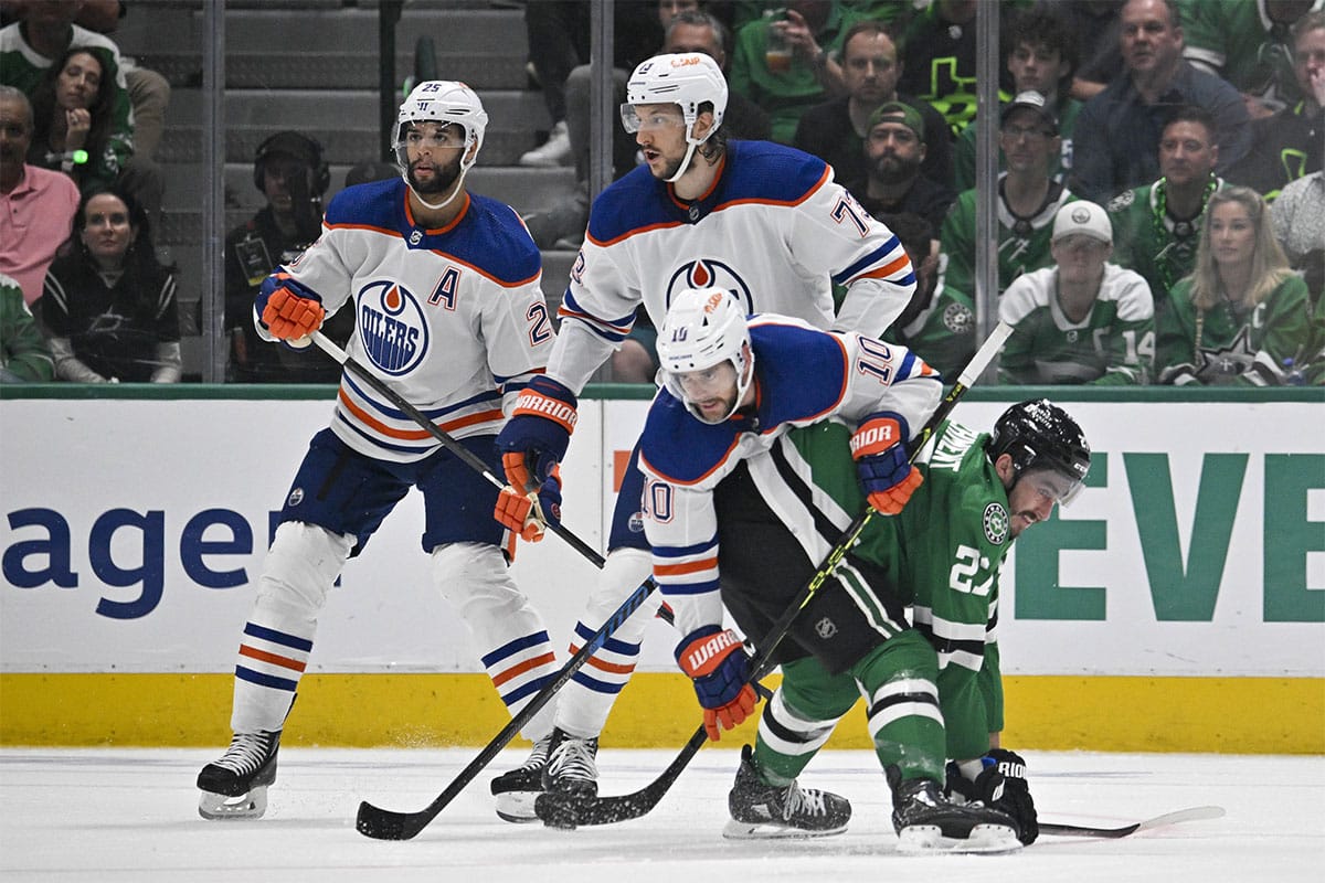 Edmonton Oilers center Derek Ryan (10) takes down Dallas Stars left wing Mason Marchment (27) as left wing Evander Kane (91) and defenseman Vincent Desharnais (73) look on during the third period in game two of the Western Conference Final of the 2024 Stanley Cup Playoffs at American Airlines Center.