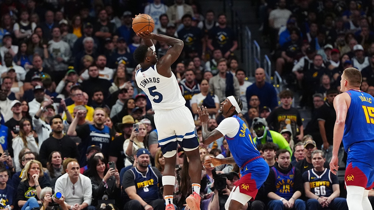 Minnesota Timberwolves guard Anthony Edwards (5) shoots the ball over Denver Nuggets guard Kentavious Caldwell-Pope (5) in the fourth quarter during game one of the second round for the 2024 NBA playoffs at Ball Arena.