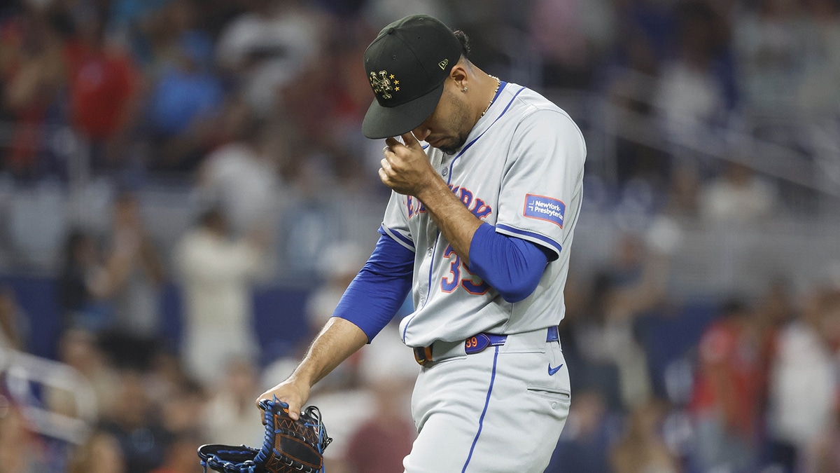 New York Mets relief pitcher Edwin Diaz (39) reacts as he leaves the mound after giving up four runs against the Miami Marlins in the ninth inning at loanDepot Park. 
