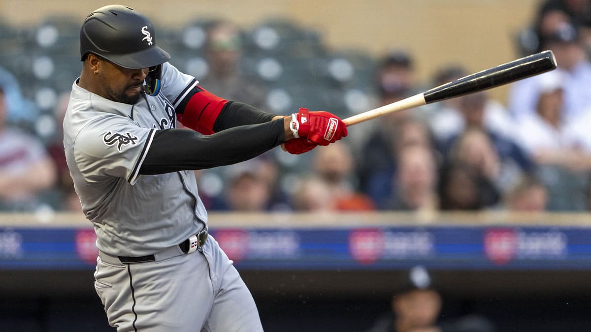Chicago White Sox designated hitter Eloy Jiménez (74) hits a single against the Minnesota Twins in the fourth inning at Target Field. 